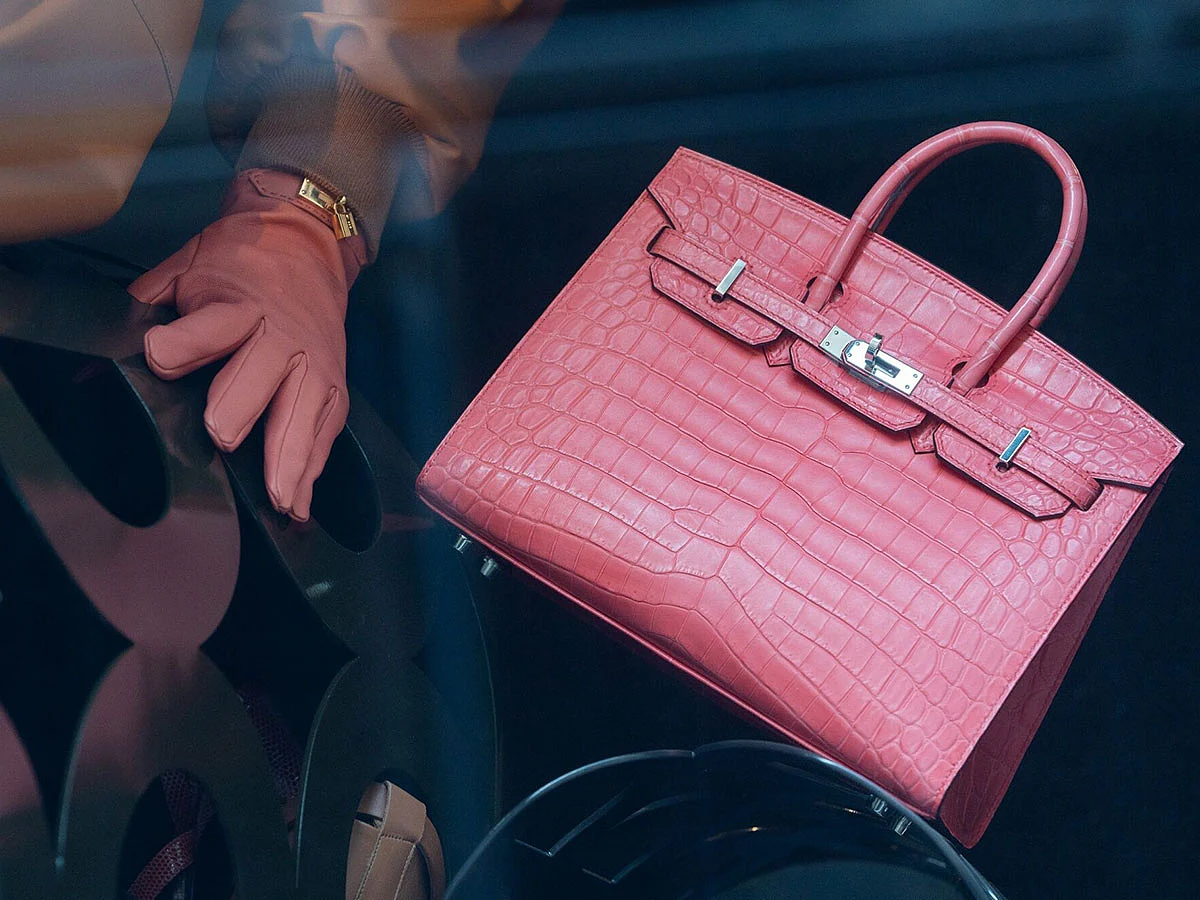 A Birkin handbag in the window display of a Hermes luxury boutique in Paris, France