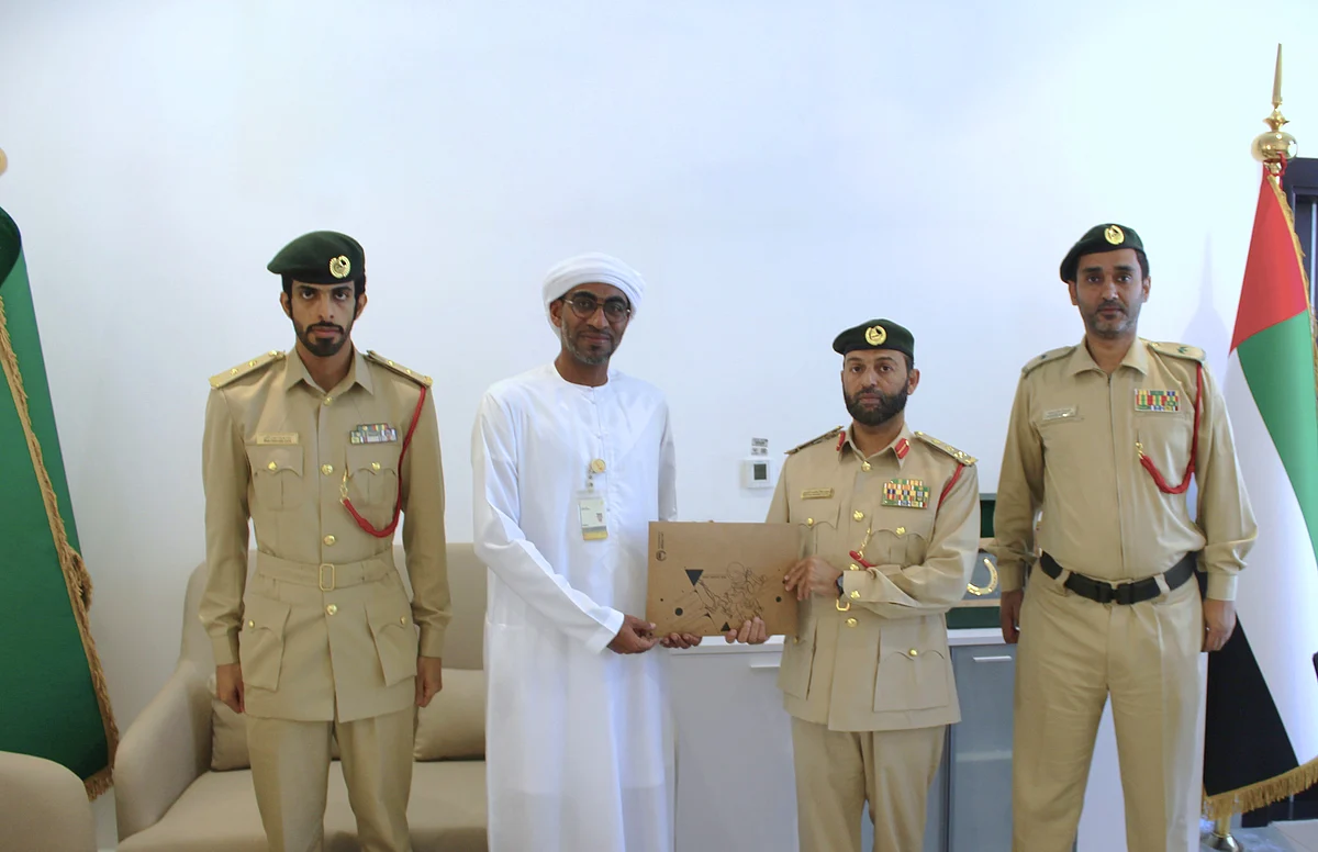 Officers honour Ali Darwish Hassan Ali Al Bloushi at Al Faqaa Dubai Police Station