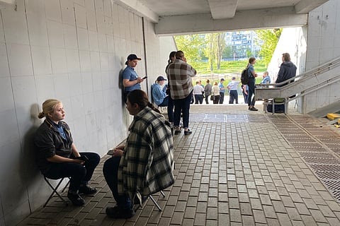 People take shelter in an underpass in Kyiv on April 21,2025 during an alert due to a drone attack that started shorty after an announcement of an Easter truce by Russian president Vladimir Putin,amid Russian invasion in Ukraine.