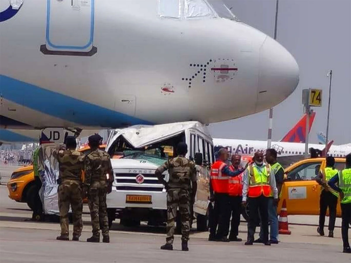 The vehicle is seen beneath the nose wheel area of the grounded A320 aircraft.