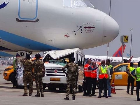 The vehicle is seen beneath the nose wheel area of the grounded A320 aircraft.