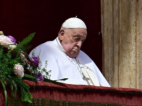 Pope Francis at the main balcony of St. Peter's basilica during the Urbi et Orbi message and blessing to the city and the world as part of Easter celebrations, at St Peter's square in the Vatican.