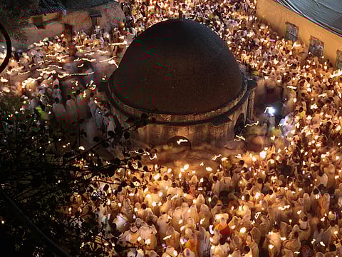 Ethiopian Orthodox Christian pilgrims hold candles during the ceremony of the "Holy Fire" at the Deir Al-Sultan Monastery on the roof of the Holy Sepulchre Church in Jerusalem's Old City on the eve of Orthodox Easter.