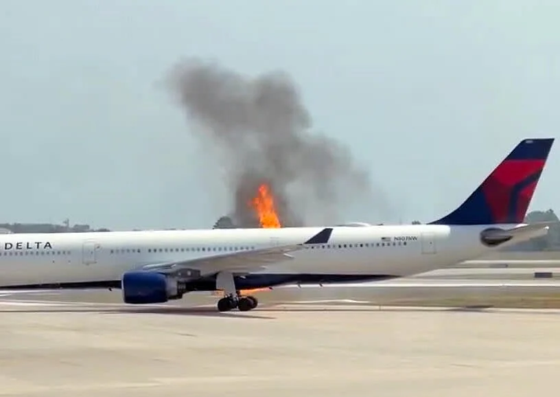  The airline said crews evacuated the cabin when flames were seen in the tailpipe of one of the plane's two main engines.