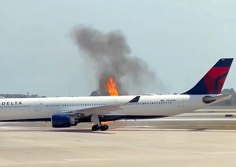  The airline said crews evacuated the cabin when flames were seen in the tailpipe of one of the plane's two main engines.
