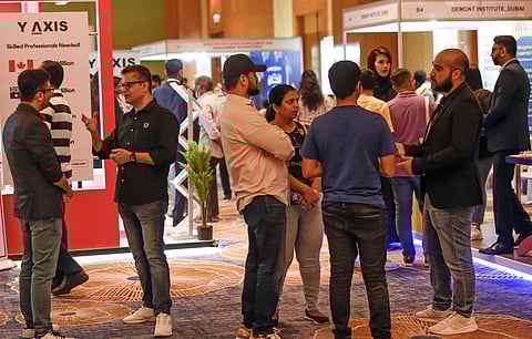 Families interacting with representatives of top universities at Edufair 