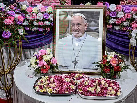 A portrait of Pope Francis is pictured during a condolence meeting in New Delhi on April 21, 2025, following the news of his death.