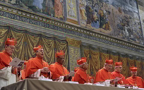 A file picture released by the Vatican Press office shows cardinals chanting the Latin hymn "Veni Creator Spiritus" ("Come Creator Spirit") in the Sistine Chapel before the start of the conclave at the Vatican on March 12, 2013.