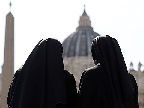 Nuns in Saint Peter's Square on the day of Pope Francis' death in Vatican City.