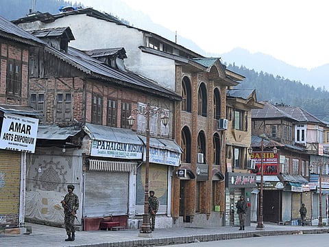 Indian paramilitary personnel conduct a patrol in Pahalgam following an attack on tourists.