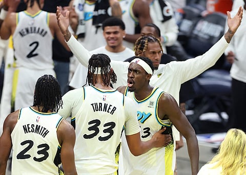 Aaron Nesmith #23, Myles Turner #33, and Pascal Siakam #43 of the Indiana Pacers celebrate after beating the Milwaukee Bucks 123-115 in Game Two of the Eastern Conference First Round NBA Playoffs at Gainbridge Fieldhouse in Indianapolis, Indiana.