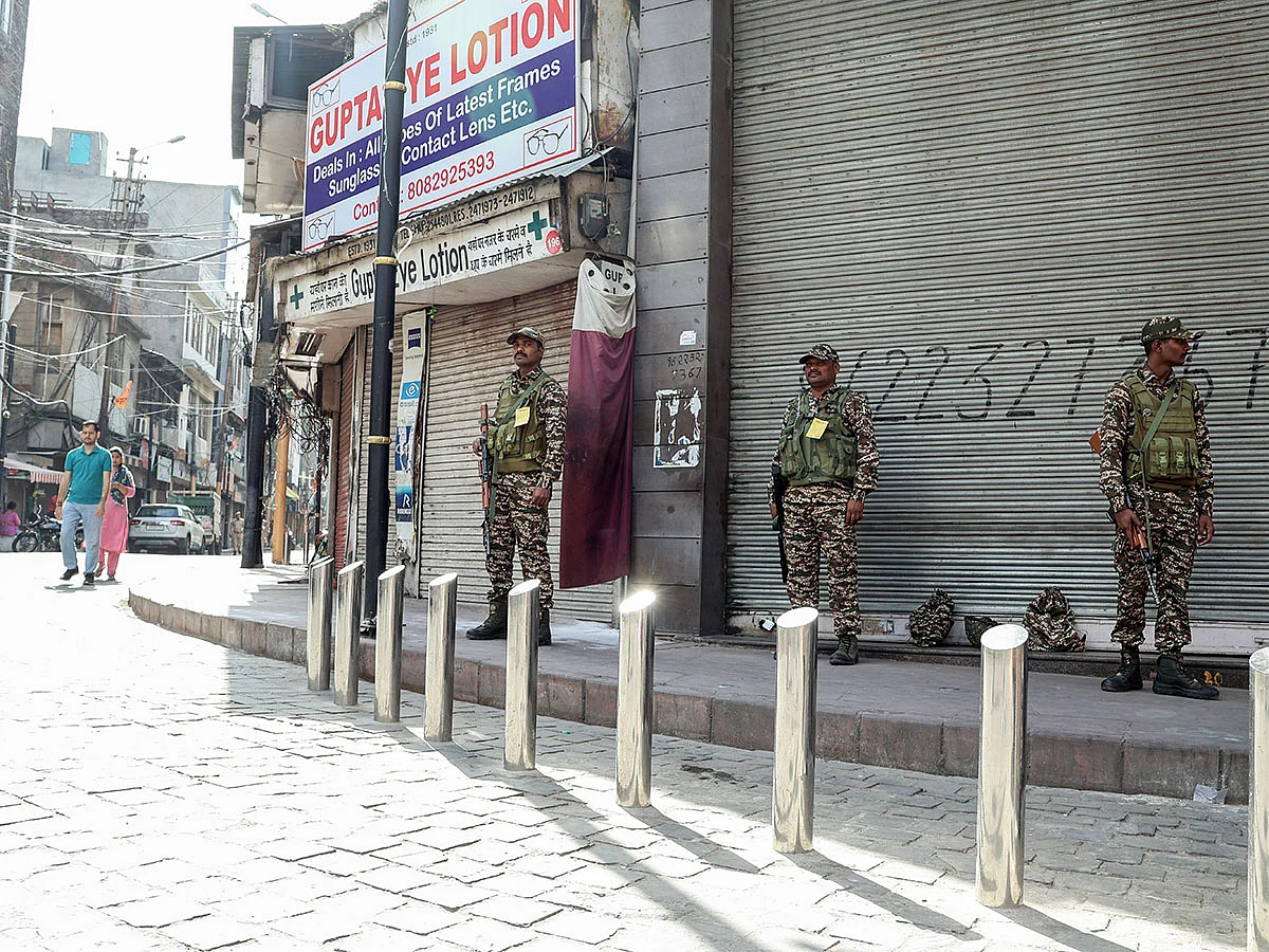 Paramilitary personnel stand guard as shops remain closed after 'Jammu Bandh' call by various organisations over Pahalgam terror attack.