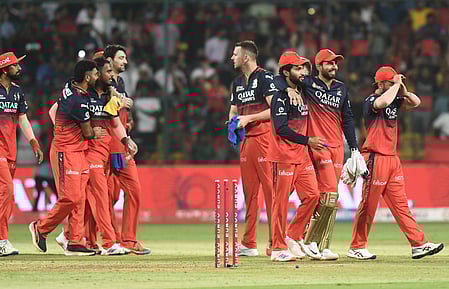 Royal Challengers Bengaluru players celebrate their win.