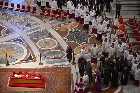 the late Pope's coffin from the chapel of Santa Marta to St Peter's Basilica, in the Vatican on April 23, 2025. 