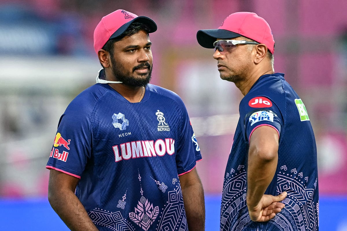 Rajasthan Royals captain Sanju Samson (left) speaks with head coach Rahul Dravid before the IPL match against the Gujarat Titans in Jaipur on April 28, 2025.