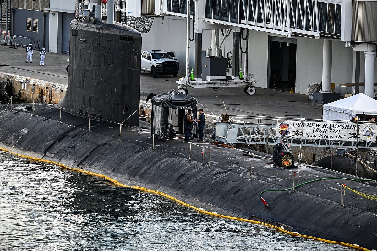 US Navy personnel stand a top USS New Hampshire (SSN-778), a Virginia-class nuclear-powered attack submarine at Port Everglades in Fort Lauderdale, Florida, on April 29, 2025.