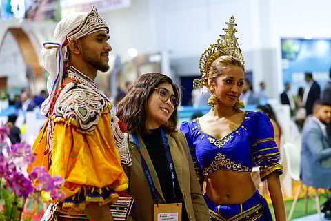 Visitors get their photos clicked at the Sri Lanka pavilion on the second day of the Arabian Travel Market. 