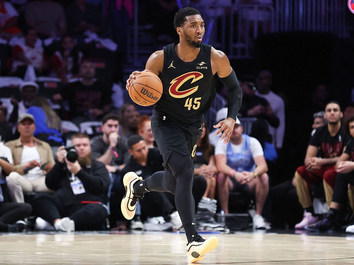 Donovan Mitchell #45 of the Cleveland Cavaliers dribbles the ball against the Miami Heat during the first quarter in Game Four of the Eastern Conference First Round NBA Playoffs at Kaseya Center.