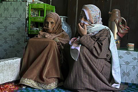 Baby Jan (left) and Asmat Jan, the mother and sister of slain Kashmiri horseman Syed Adil Shah, in their village home at Hapatnar in Anantnag district on April 29, 2025. 