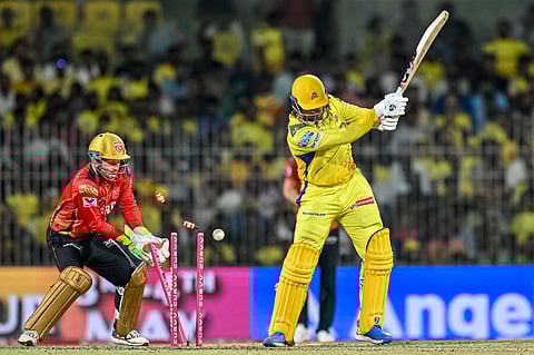 Chennai Super Kings' Anshul Kamboj (R) is clean bowled by Punjab Kings' Yuzvendra Chahal during the Indian Premier League (IPL) Twenty20 cricket matchat the MA Chidambaram Stadium in Chennai on April 30.