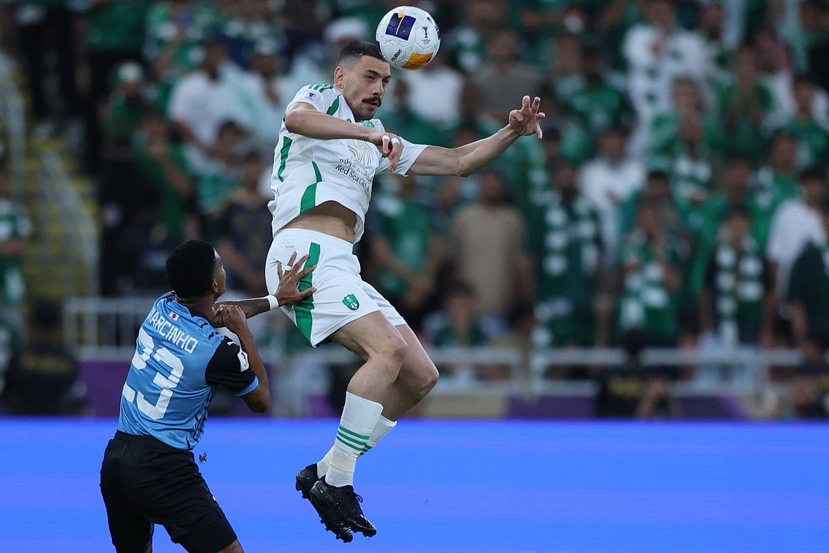 Ahli's defnder  Merih Demiral heads the ball as he is marked by Kawasaki's forward Marcinho during the AFC Champions League final  at King Abdullah Sports City in Jeddah on May 3, 2025.