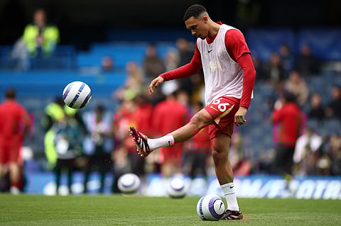 Liverpool's English defender Trent Alexander-Arnold warms up ahead of the English Premier League football match against Chelsea at Stamford Bridge in London on May 4.