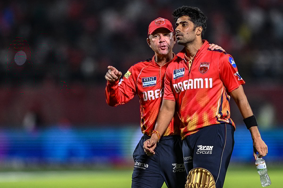 Punjab Kings' head coach Ricky Ponting (left) speaks with team's player Shashank Singh during the Indian Premier League 2025.