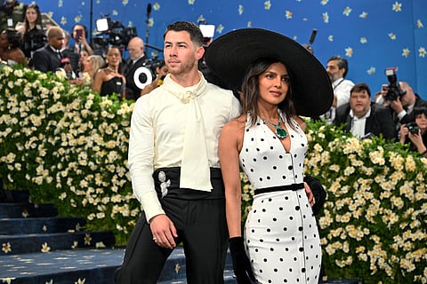 Go big,  bling or go home! Check out Priyanka Chopra Jonas with Nick Jonas wearing a 241-carat Emerald at this year's Met Gala.