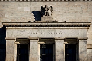 US Fed to hold interest rates steady as pressures mount