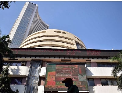 Sensex closes in green after volatile trade.