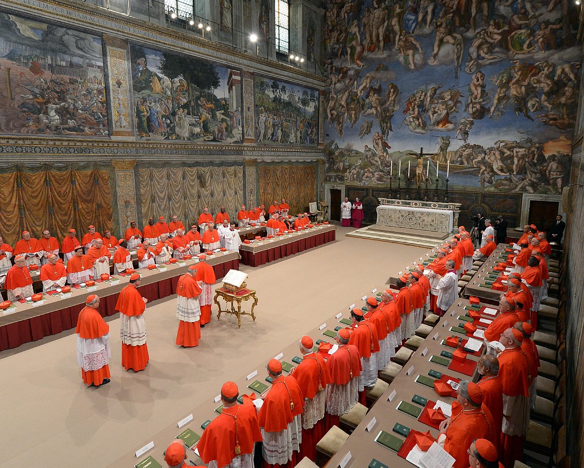 A handout picture released by the Vatican Press office shows cardinals queuing in the Sistine Chapel before the start of the conclave at the Vatican on March 12, 2013.