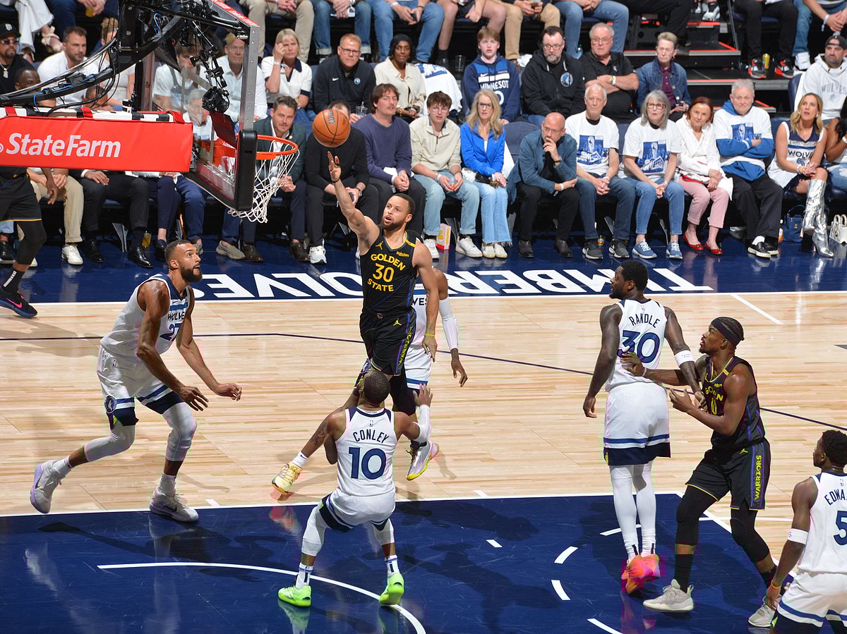 Stephen Curry of the Golden State Warriors drives to the basket during the game against the Minnesota Timberwolves during Round 2 Game 1 of the 2025 NBA Playoffs.
