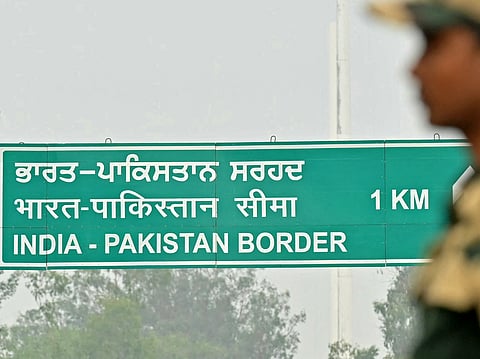 An Indian Border Security Force (BSF) soldier stands guard near the India-Pakistan Wagah border post, about 35kms from Amritsar on May 7, 2025.