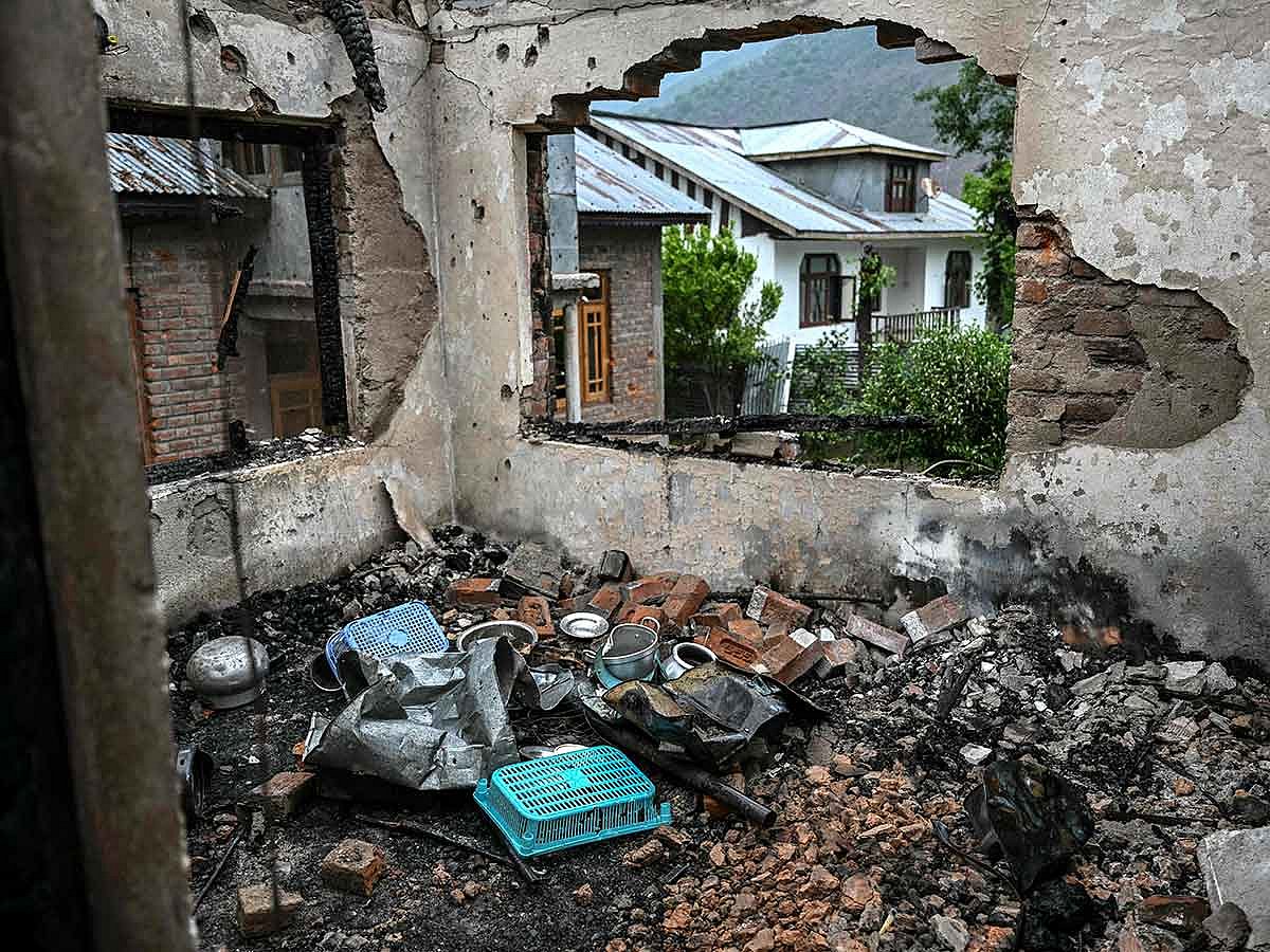 Scattered rubble along with utensils is pictured inside a house destroyed by Pakistani artillery shelling at the Salamabad village in Uri, about 110kms from Srinagar, on May 8, 2025. 