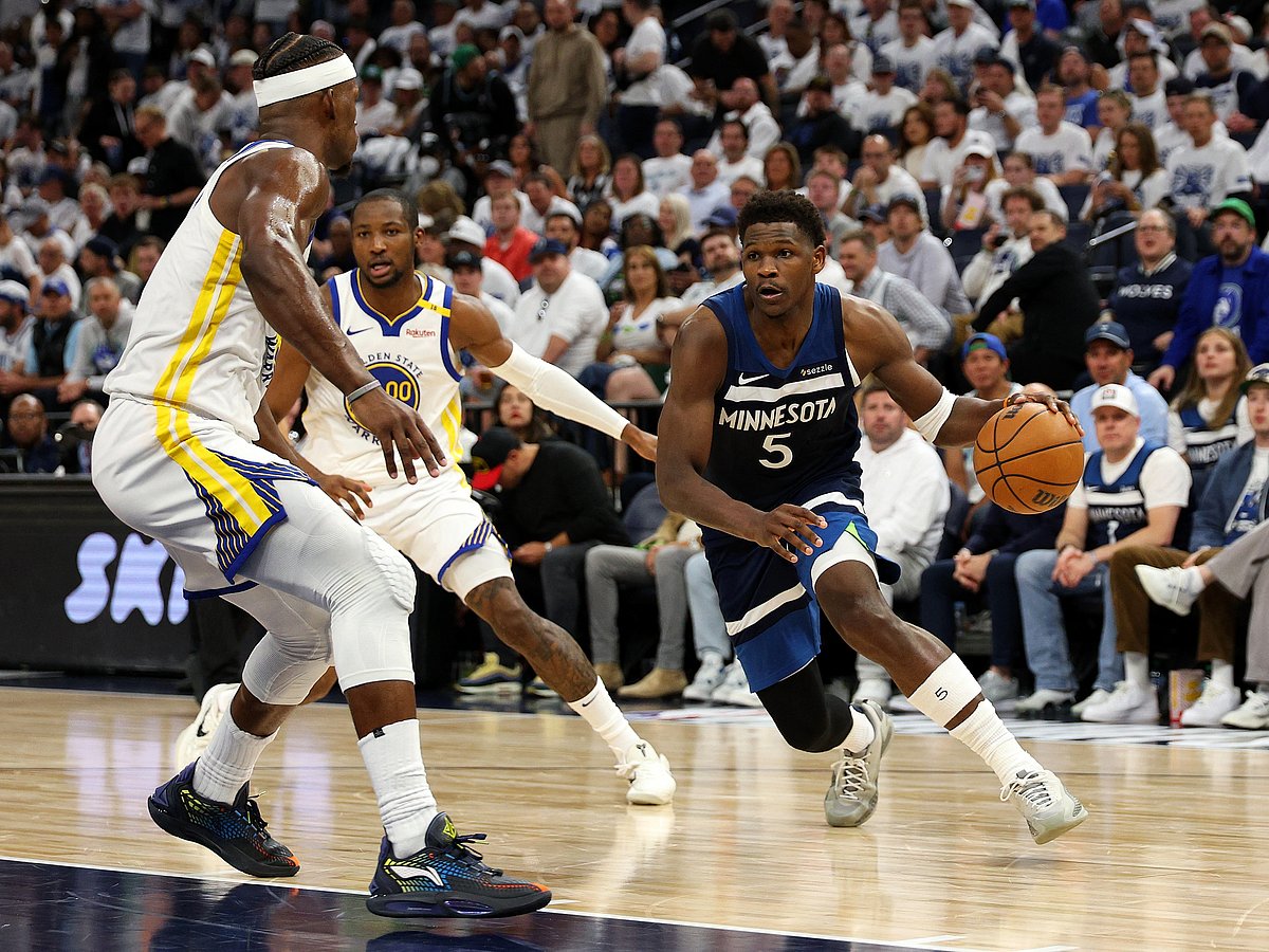 Anthony Edwards of the Minnesota Timberwolves drives to the basket against Jimmy Butler III of the Golden State Warriors in the fourth quarter of Game Two of the Western Conference Second Round NBA Playoffs.