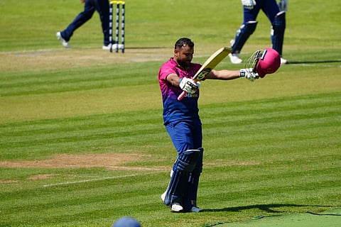 UAE skipper Rahul Chopra celebrates after scoring his century against Scotland in the Cricket World Cup League 2 match.