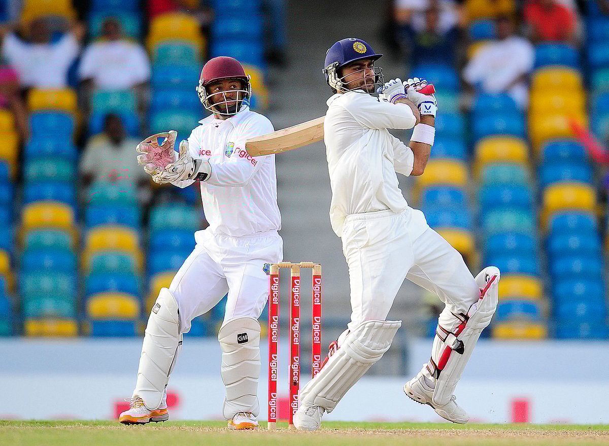 Virat Kohli has consistently risen to the occasion, from steering India to memorable overseas victories to delivering crucial centuries under pressure.
Let’s look back at some of his most explosive and game-changing innings in Test cricket for India. Virat Kohli plays a shot in front of West Indies wicketkeeper Carlton Baugh during the test match between West Indies and India at Kensington Oval in Bridgetown, Barbados. Kohli made his Test debut in June 2011 in the series against West Indies.
