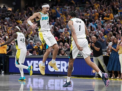 Andrew Nembhard #2 and Obi Toppin #1 of the Indiana Pacers celebrate in the second quarter against the Cleveland Cavaliers during Game Four of the Eastern Conference Semifinals at Gainbridge Fieldhouse.