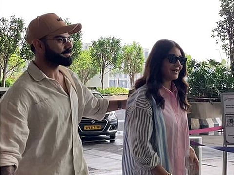 Virat Kohli and Anushka Sharma in a jovial mood as they arrive at Mumbai Airport on Monday.
