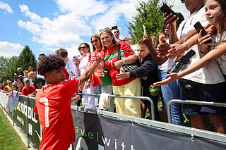 Portugal's U15 national football team player Cristiano Dos Santos (L), son of Cristiano Ronaldo, is congratulated by his grand mother Dolores Dos Santos after winning a match between Portugal and Japan as part of the Vlatko-Markovic U15 youth tournament in Sveti Martin na Muri on May 13 2025.