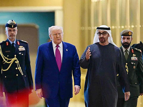 UAE President Sheikh Mohamed bin Zayed Al Nahyan welcomes his US counterpart Donald Trump upon arrival at the presidential terminal in Abu Dhabi on May 15, 2025. 