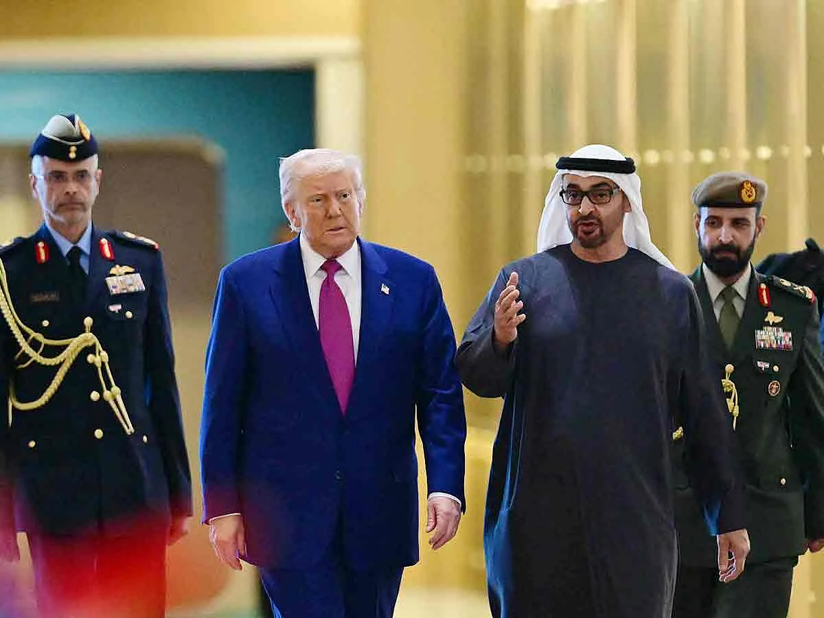 UAE President Sheikh Mohamed bin Zayed Al Nahyan welcomes his US counterpart Donald Trump upon arrival at the presidential terminal in Abu Dhabi on May 15, 2025. 