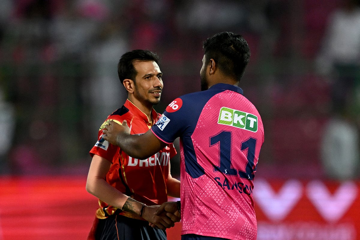 Sanju Samson (R) greets Yuzvendra Chahal.