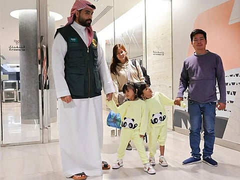 Filipino twin sisters Klea and Maurice Ann with their parents upon their arrival in Riyadh.