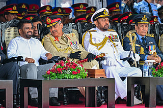 Sri Lankan President Anura Kumara Dissanayake (L) and Field Marshal Sarath Fonseka (2L), Admiral of the Fleet Wasantha Karannagoda (2R) and Marshal of the Air Force Roshan Gunathilake (R) participate a ceremony to commemorate the 16th anniversary of the National War Heroes Day, marking the end of the island's civil war, in front of the War Heroes Monument in Colombo on May 19, 2025.