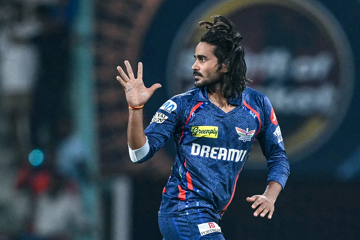 Lucknow Super Giants' Digvesh Rathi celebrates after taking the wicket of Sunrisers Hyderabad's Abhishek Sharma during the Indian Premier League (IPL) Twenty20 cricket match at the Ekana Cricket Stadium in Lucknow on May 19, 2025.