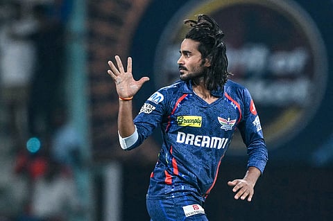 Lucknow Super Giants' Digvesh Rathi celebrates after taking the wicket of Sunrisers Hyderabad's Abhishek Sharma during the Indian Premier League (IPL) Twenty20 cricket match at the Ekana Cricket Stadium in Lucknow on May 19, 2025.