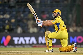 Chennai Super Kings' captain MS Dhoni watches the ball after playing a shot during the Indian Premier League (IPL) Twenty20 cricket match between Chennai Super Kings and Rajasthan Royals at the Arun Jaitley Stadium in New Delhi on May 20, 2025.
