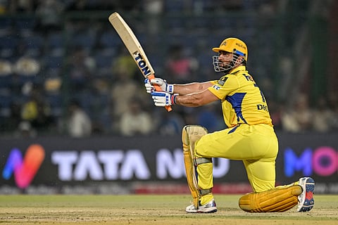 Chennai Super Kings' captain MS Dhoni watches the ball after playing a shot during the Indian Premier League (IPL) Twenty20 cricket match between Chennai Super Kings and Rajasthan Royals at the Arun Jaitley Stadium in New Delhi on May 20, 2025.