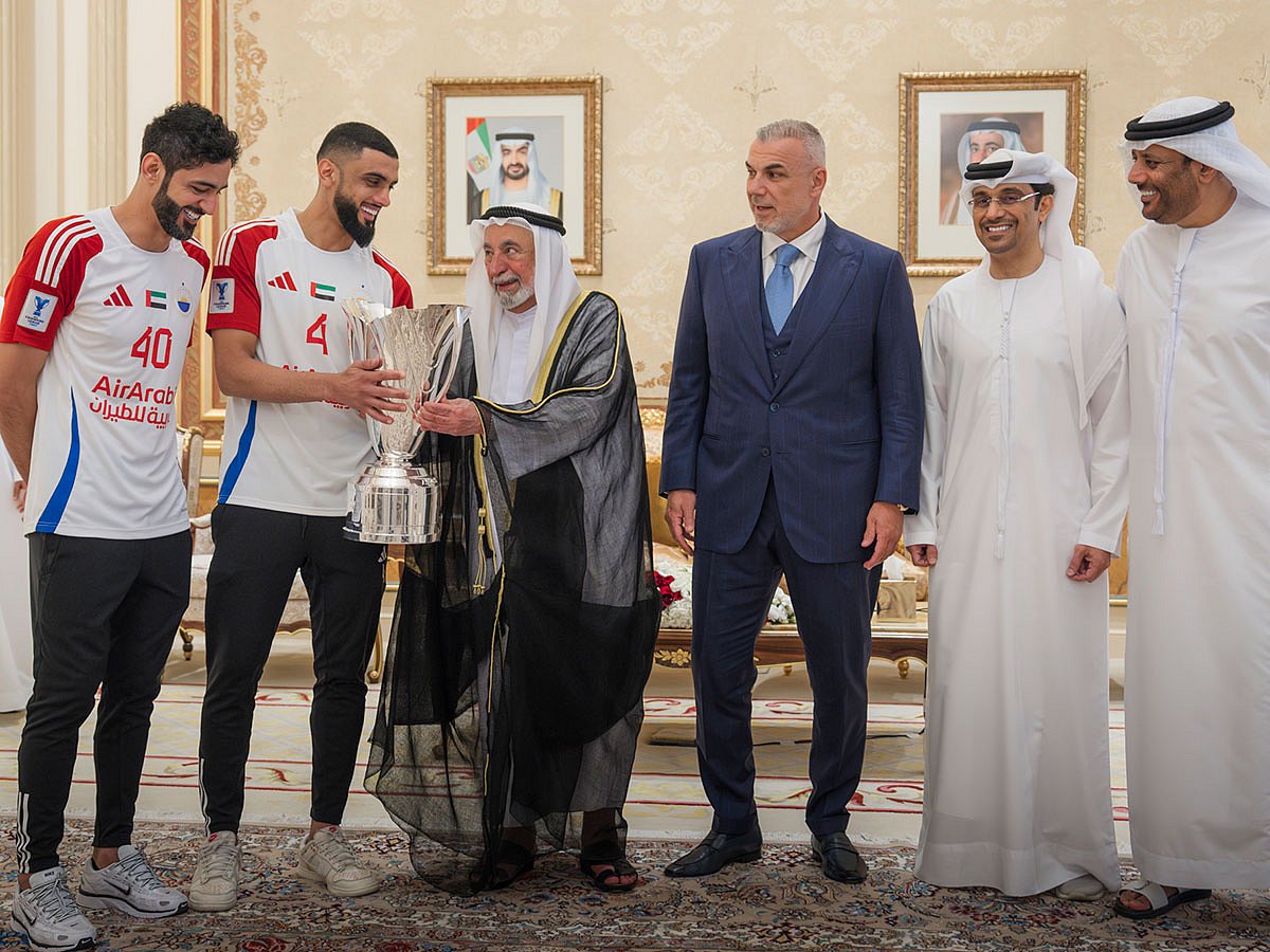Dr Sheikh Sultan receives the AFC Champions League 2 Cup during the reception to honour the victories Sharjah Football Club on Tuesday.